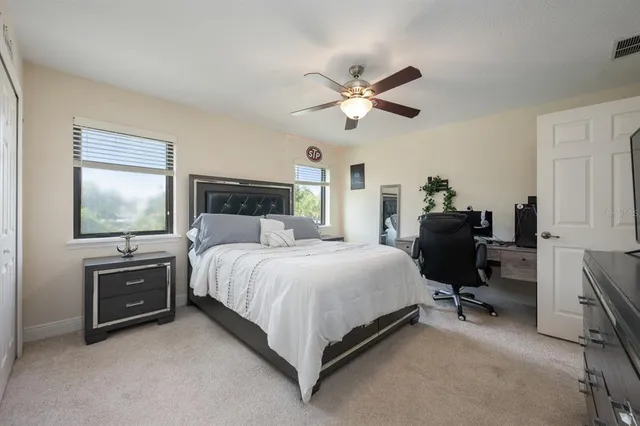 a bed room with a bed and a chandelier