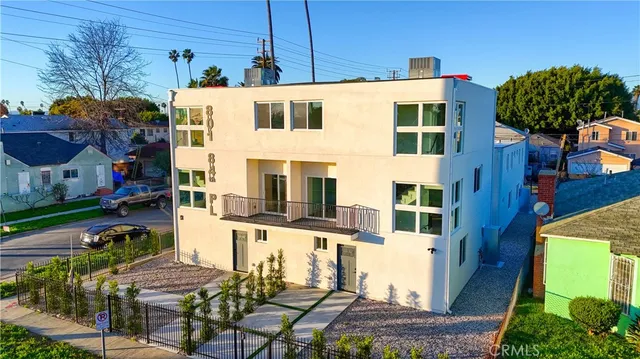 a view of a street with a building in the background