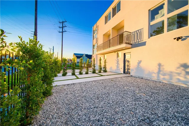 a view of a brick building next to a road