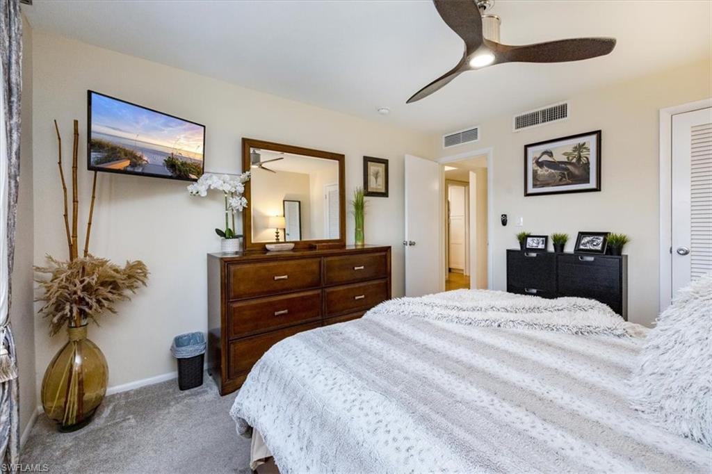 1900 Clifford Street, Unit 301 Fort Myers, FL 33901 - Photo 12 of 35 Bedroom featuring carpet floors and ceiling fan