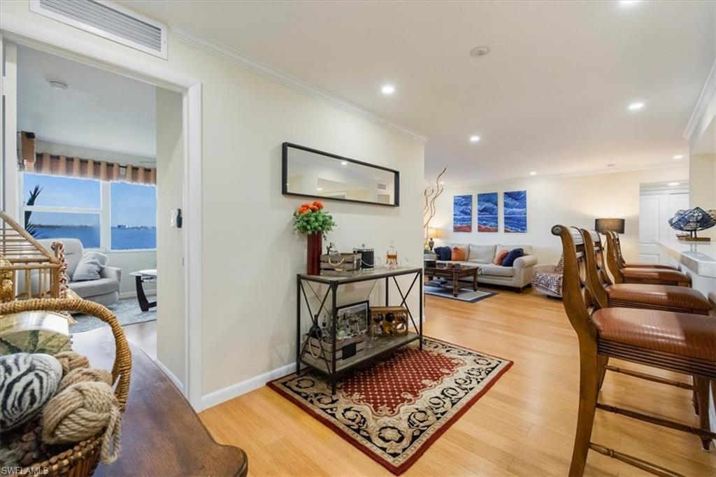 1900 Clifford Street, Unit 301 Fort Myers, FL 33901 - Photo 15 of 35 Living room with ornamental molding, light wood-style floors, and recessed lighting