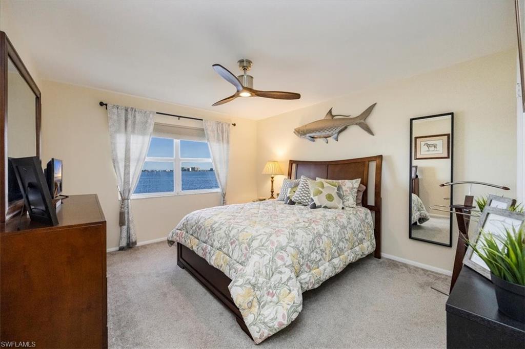1900 Clifford Street, Unit 301 Fort Myers, FL 33901 - Photo 16 of 35 Bedroom with carpet floors and a ceiling fan
