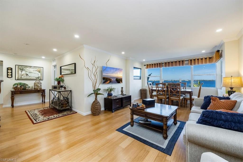 1900 Clifford Street, Unit 301 Fort Myers, FL 33901 - Photo 21 of 35 Living room featuring light wood-style floors, ornamental molding, and recessed lighting