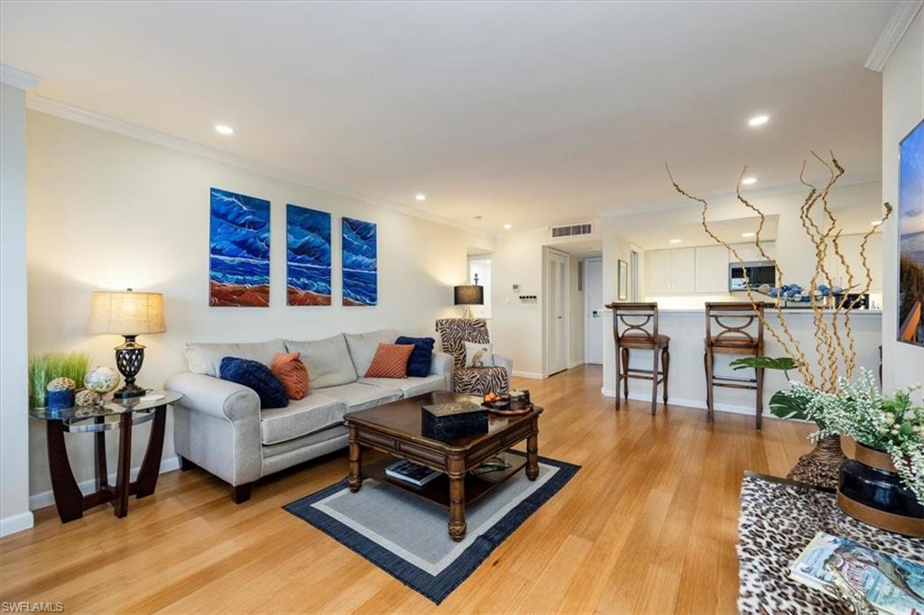 1900 Clifford Street, Unit 301 Fort Myers, FL 33901 - Photo 23 of 35 Living area featuring crown molding, light wood-type flooring, and recessed lighting