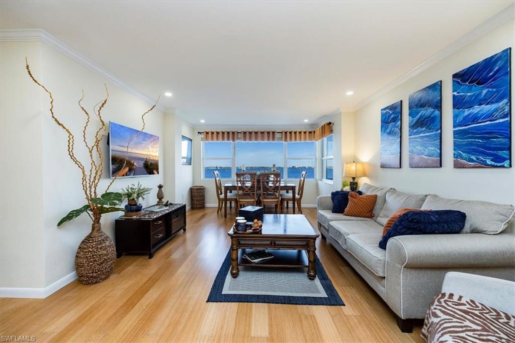1900 Clifford Street, Unit 301 Fort Myers, FL 33901 - Photo 24 of 35 Living area featuring light wood-style floors, ornamental molding, and recessed lighting