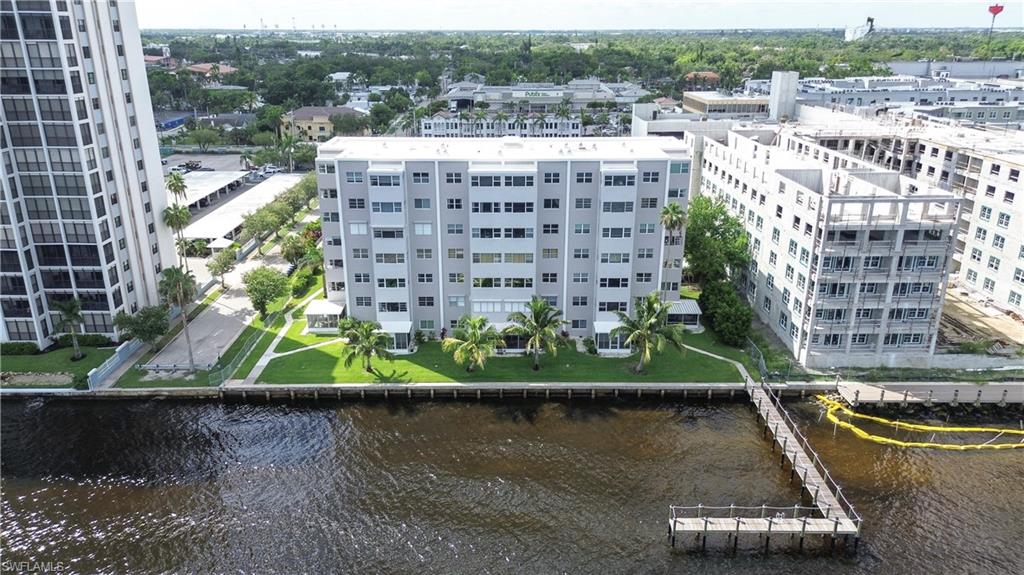 1900 Clifford Street, Unit 301 Fort Myers, FL 33901 - Photo 27 of 35 Drone / aerial view of a large body of water and apartment complex / building