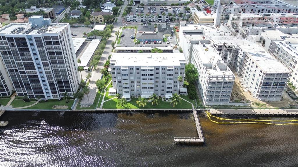 1900 Clifford Street, Unit 301 Fort Myers, FL 33901 - Photo 28 of 35 Aerial view of a large body of water and apartment complex / building
