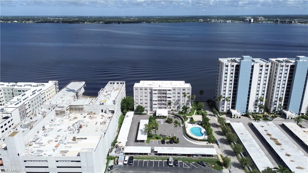 1900 Clifford Street, Unit 301 Fort Myers, FL 33901 - Photo 31 of 35 Bird's eye view of a pool and a nearby body of water