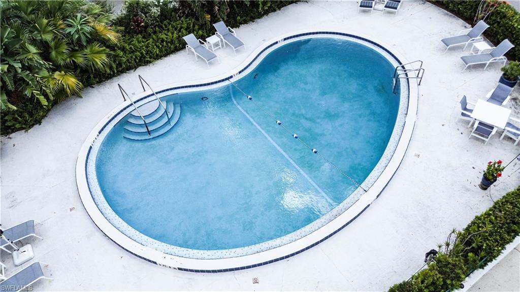 1900 Clifford Street, Unit 301 Fort Myers, FL 33901 - Photo 33 of 35 Community pool featuring a patio area
