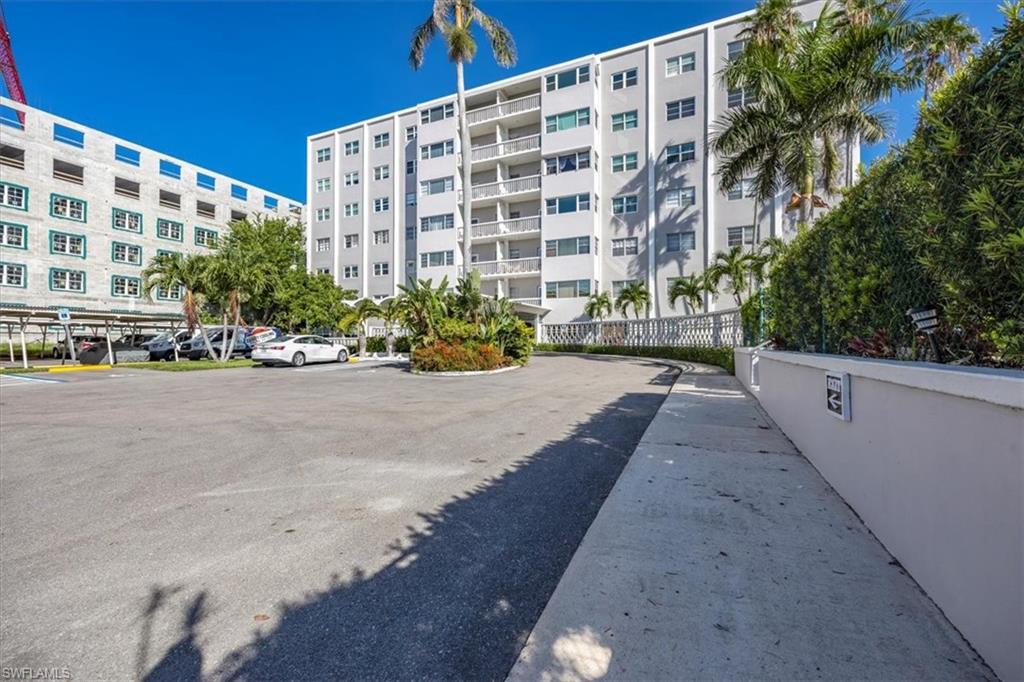 1900 Clifford Street, Unit 301 Fort Myers, FL 33901 - Photo 4 of 35 View of apartment building / complex featuring uncovered parking