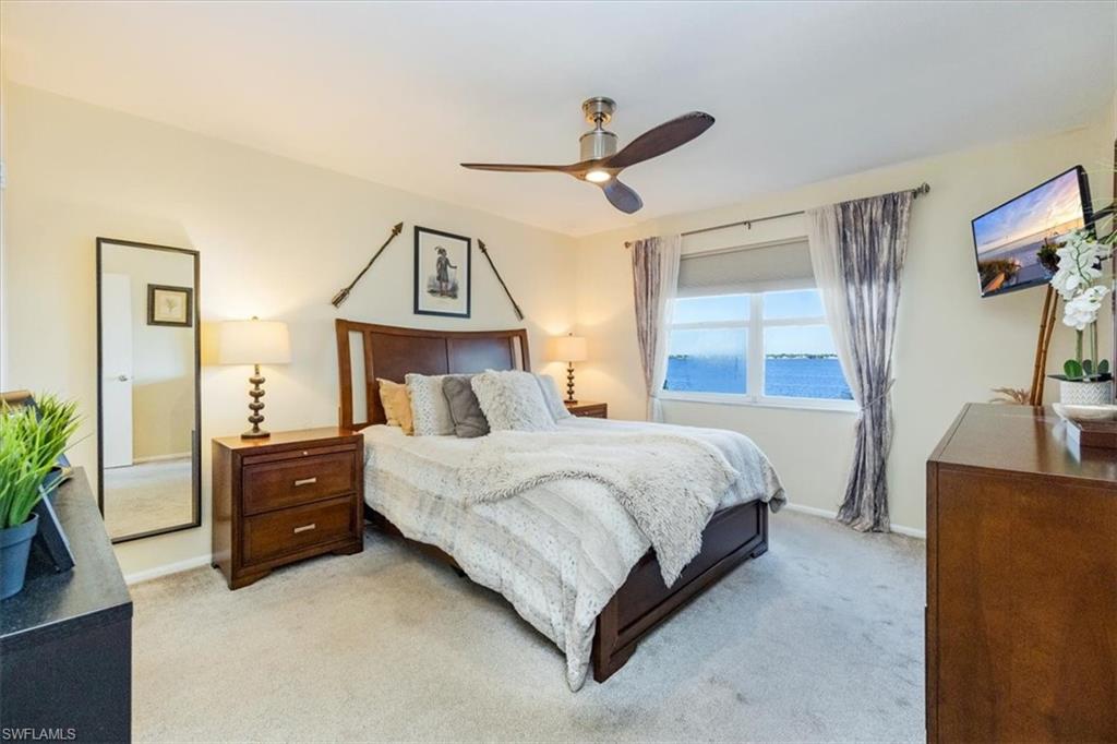 1900 Clifford Street, Unit 301 Fort Myers, FL 33901 - Photo 8 of 35 Bedroom with light colored carpet and ceiling fan