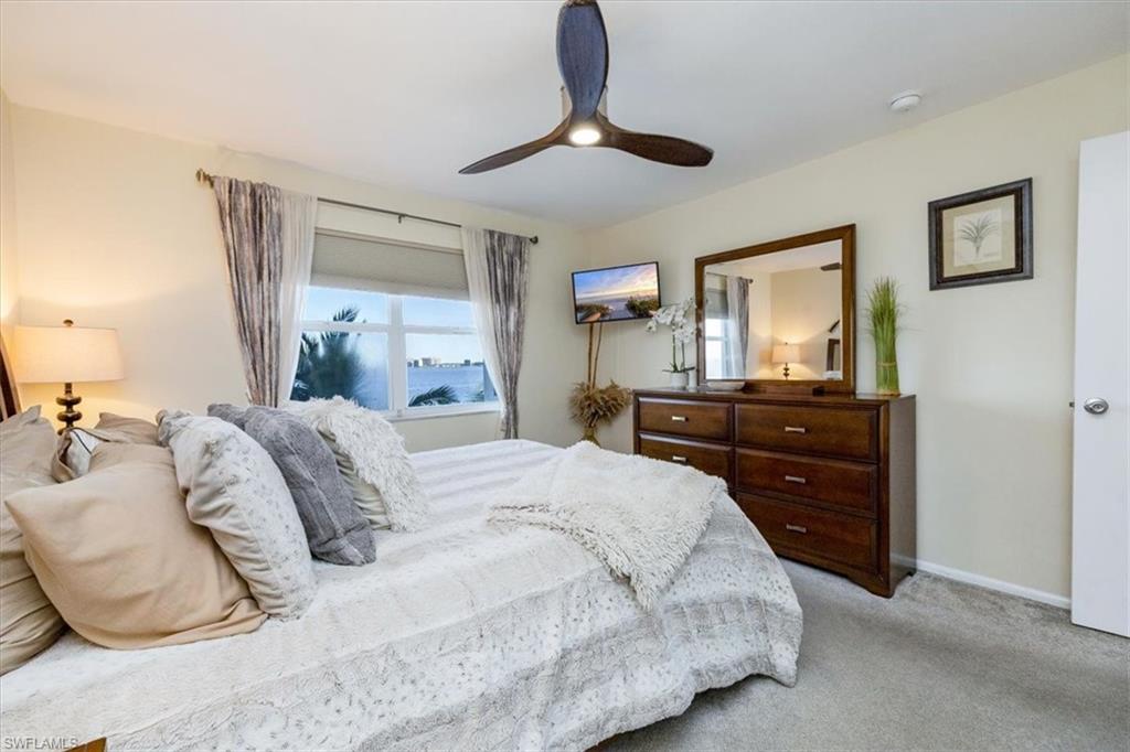 1900 Clifford Street, Unit 301 Fort Myers, FL 33901 - Photo 9 of 35 Carpeted bedroom featuring ceiling fan and baseboards