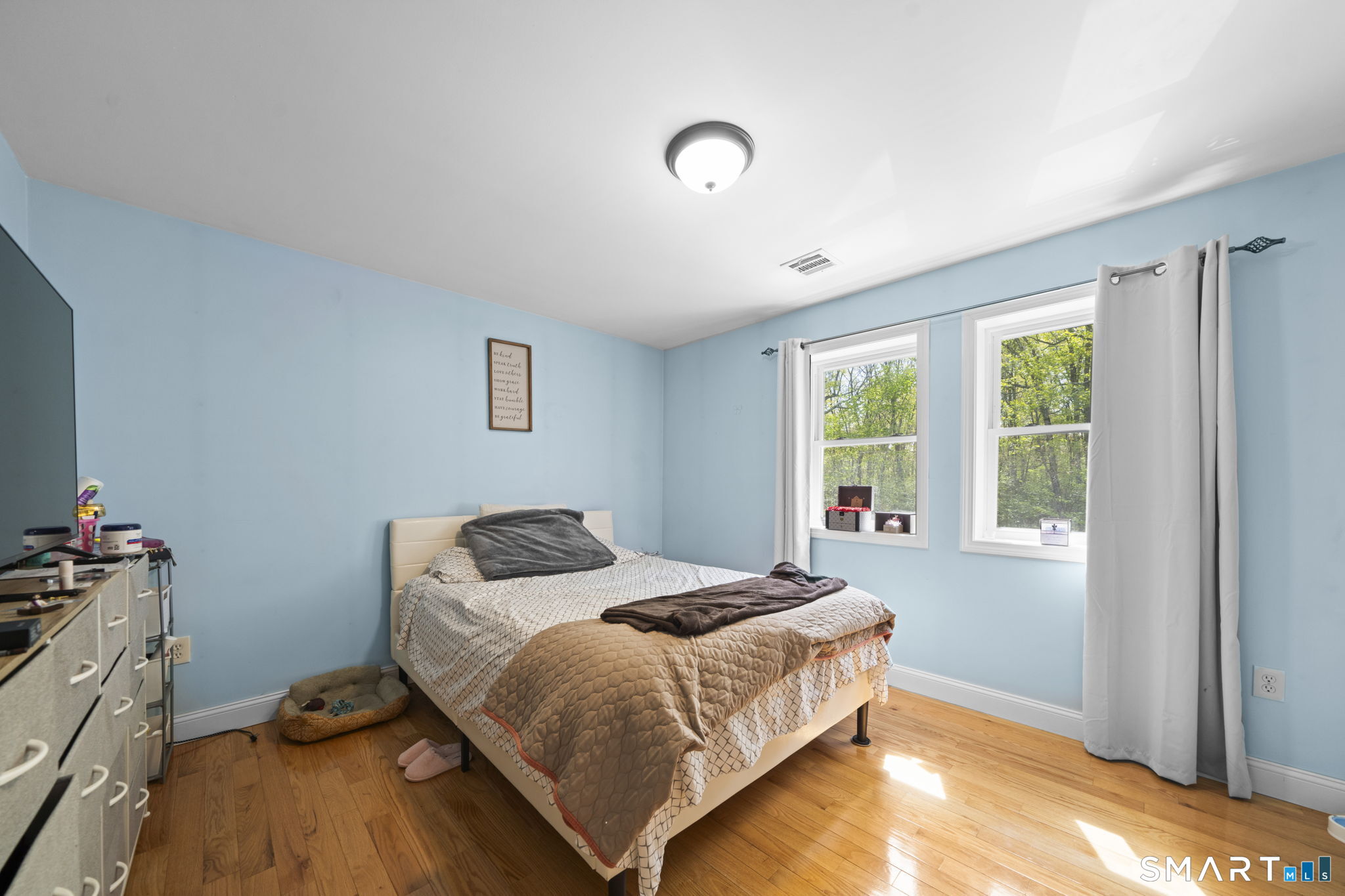 1118 Spindle Hill Road Wolcott, CT 06716 - Photo 24 of 38 a bedroom with a bed and wooden floor