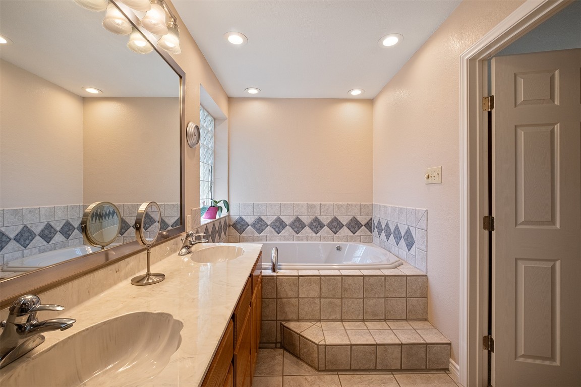 280 Sunset Terrace Cedar Park, TX 78613 - Photo 16 of 38 a bathroom with a double vanity sink and a mirror