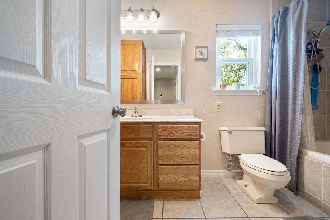 280 Sunset Terrace Cedar Park, TX 78613 - Photo 20 of 38 a bathroom with a toilet sink vanity and mirror