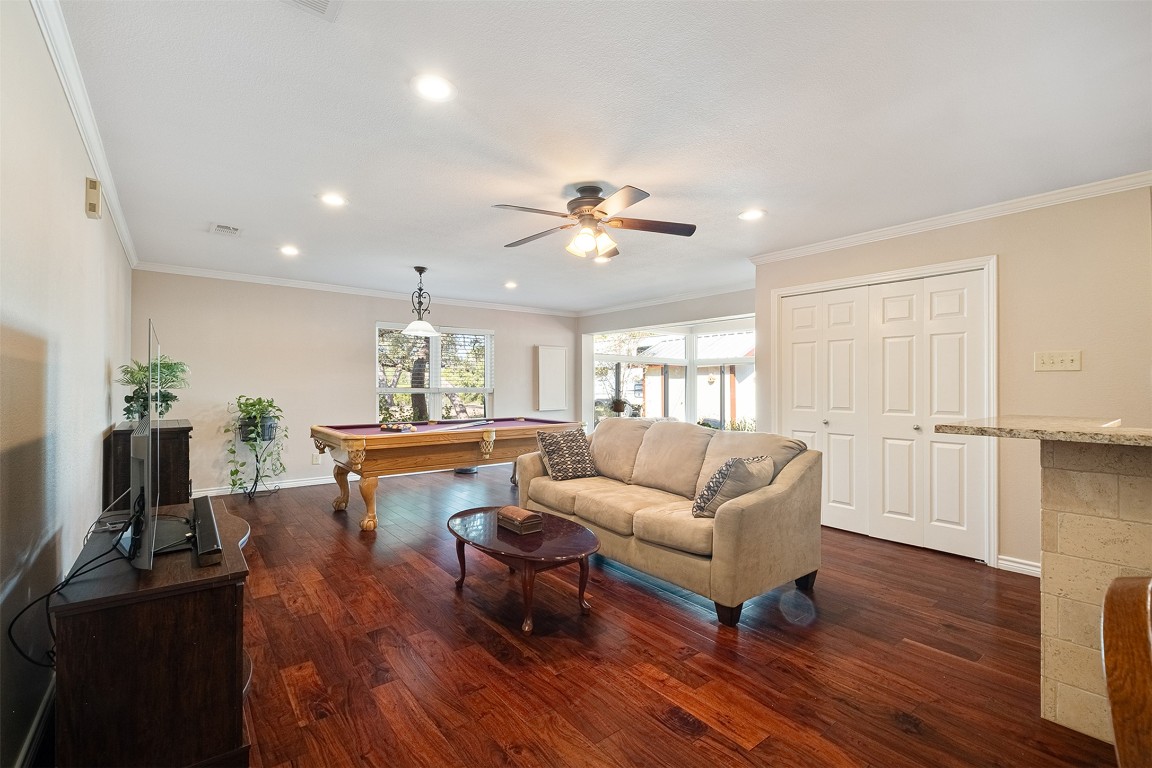 280 Sunset Terrace Cedar Park, TX 78613 - Photo 21 of 38 a living room with furniture a fireplace and a flat screen tv