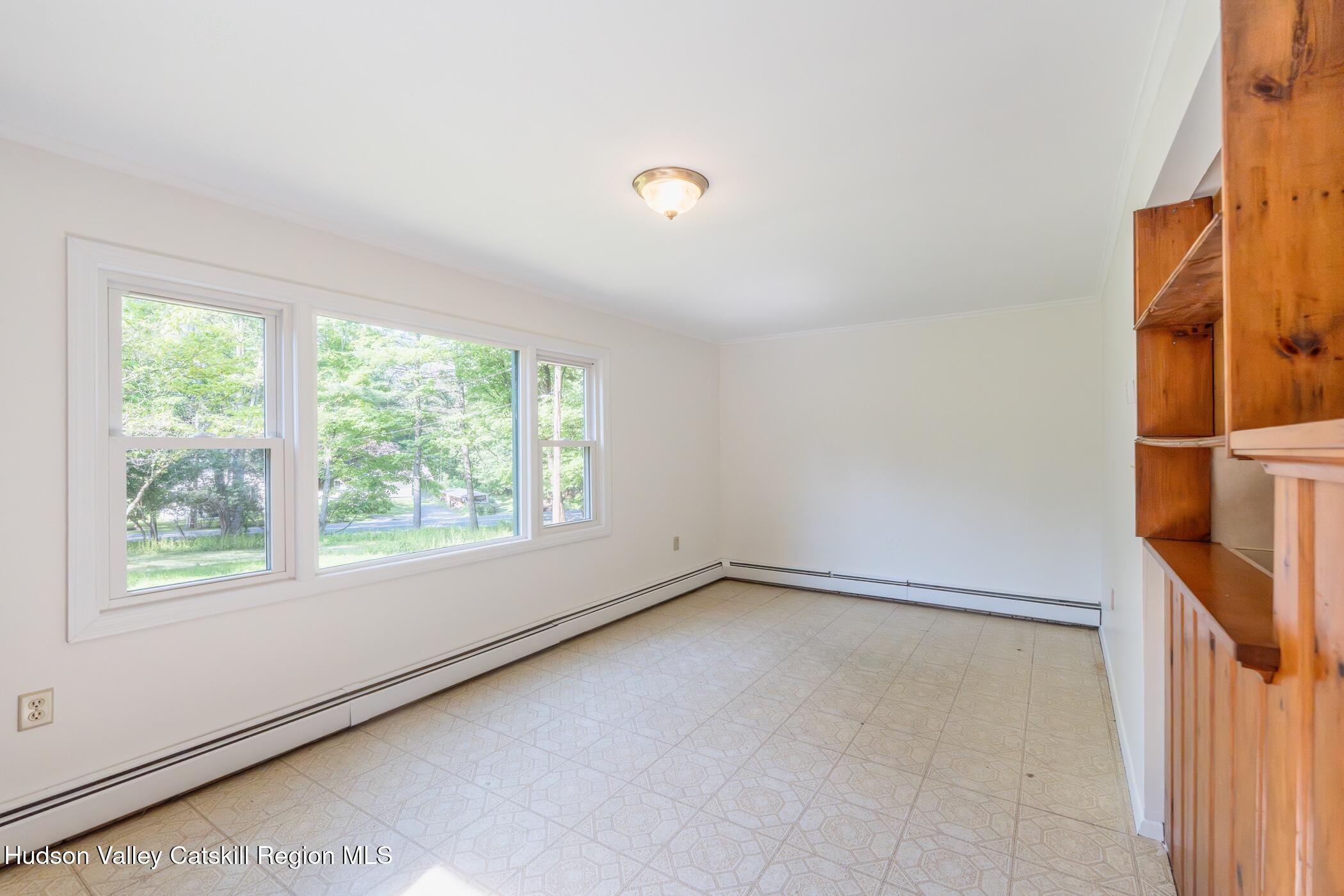 4533 Atwood Road Stone Ridge, NY 12484 - Photo 20 of 63 an empty room with windows