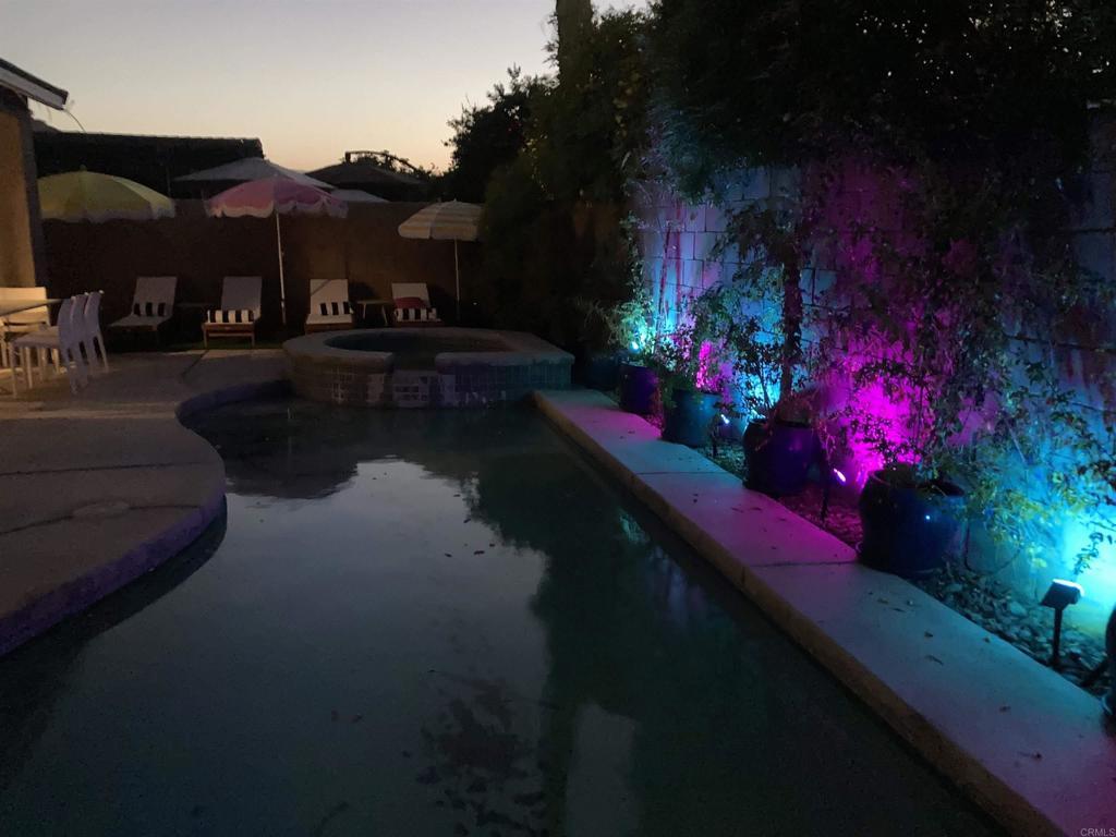 80596 Key Largo Avenue Indio, CA 92201 - Photo 46 of 59 a view of a house with a yard fire pit and a table in a patio