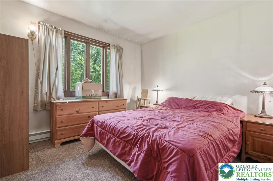 143 Logger Road Canadensis, PA 18325 - Photo 15 of 32 A window in this bedroom offers verdant views and ample natural light.
