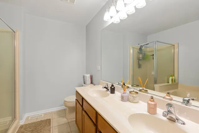 a bathroom with a sink vanity and a mirror