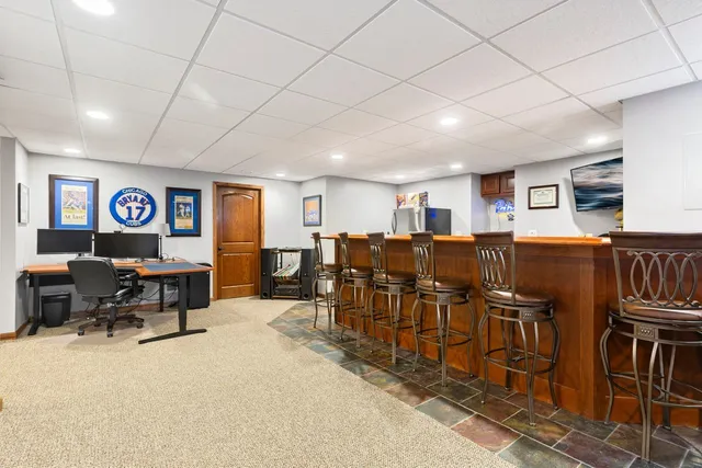 a living room with lots of furniture and appliances