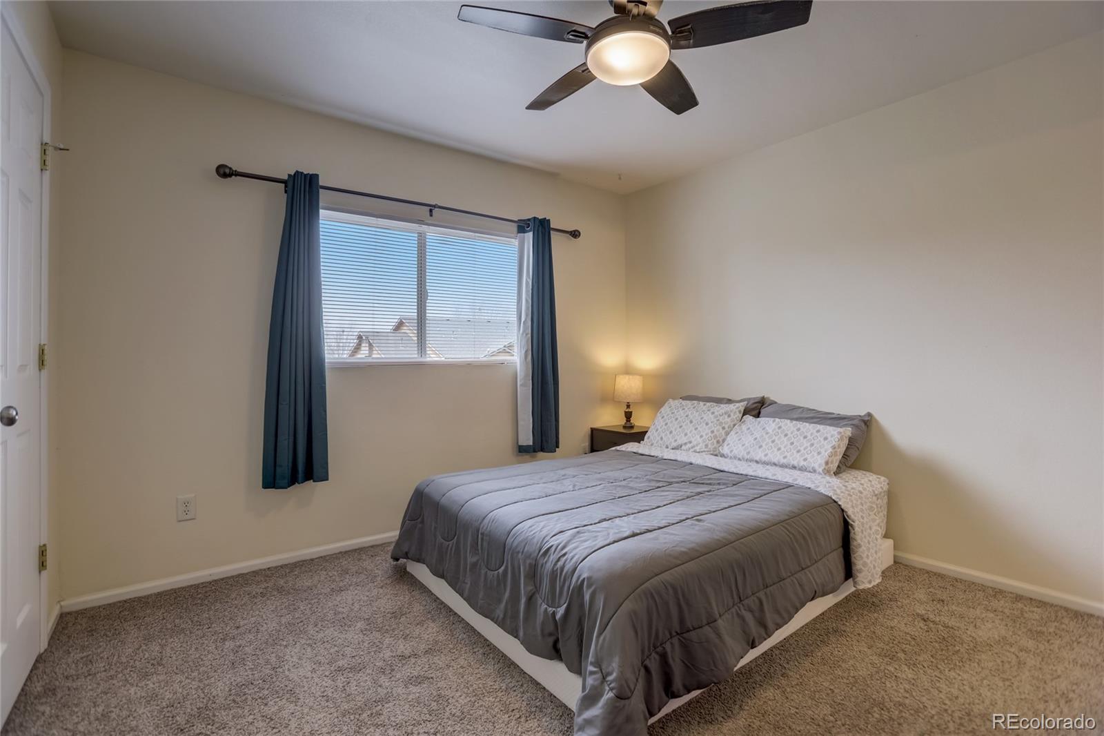 2900 Purcell Street, Unit O4 Brighton, CO 80601 - Photo 14 of 28 a bedroom with a bed and window