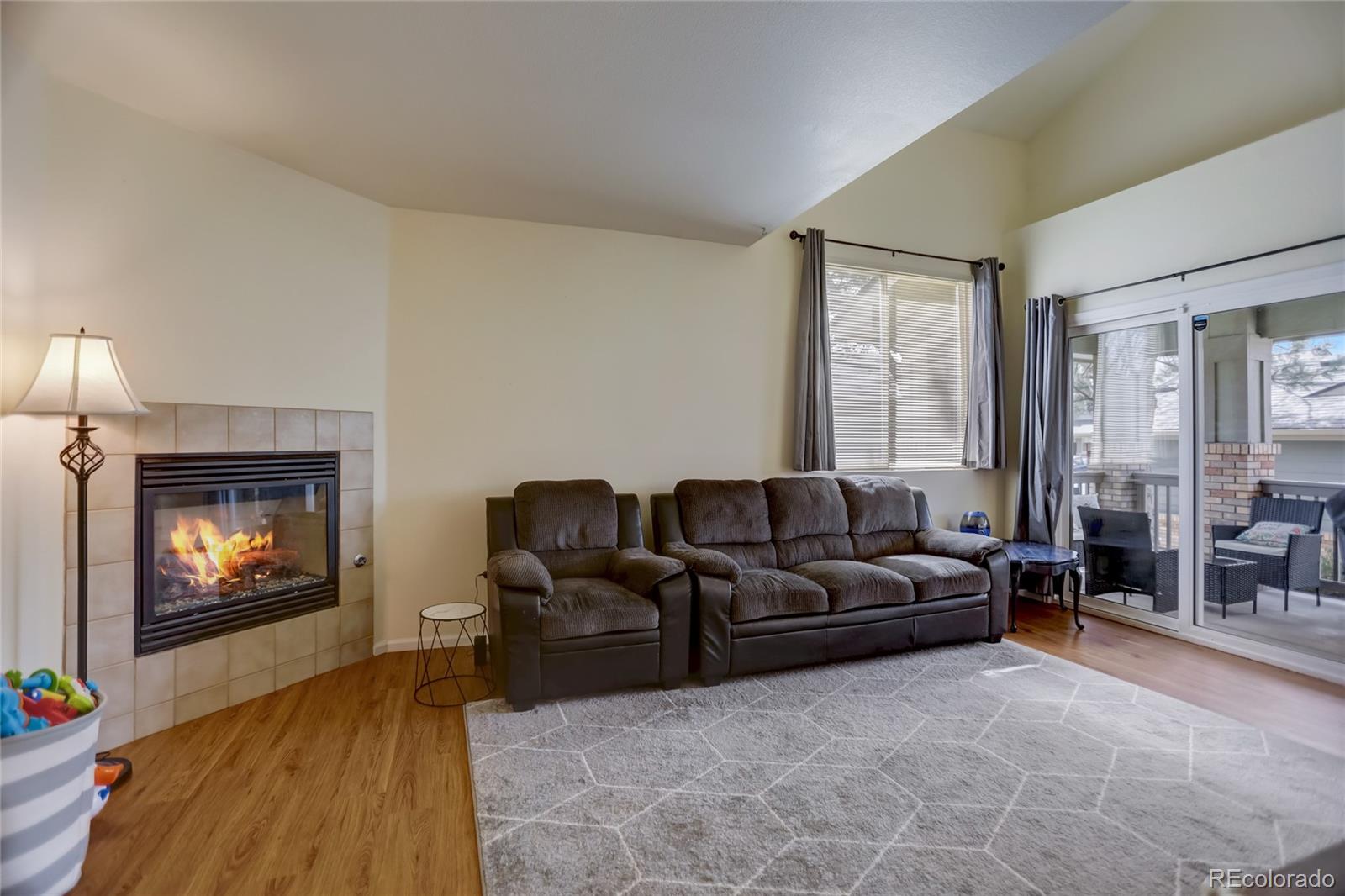 2900 Purcell Street, Unit O4 Brighton, CO 80601 - Photo 4 of 28 a living room with furniture and a fireplace