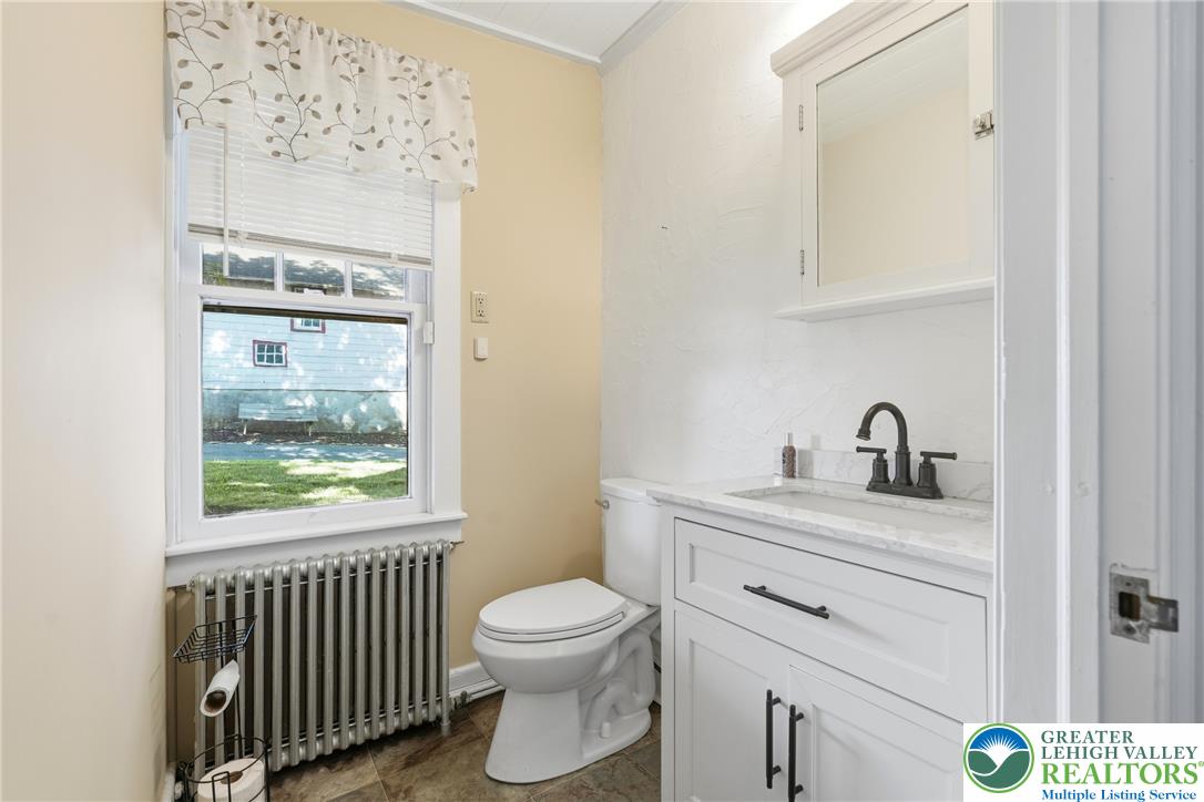 4682 Steuben Road Bethlehem, PA 18020 - Photo 22 of 79 A well-lit powder room offers functional vanity space and a window with outdoor views.