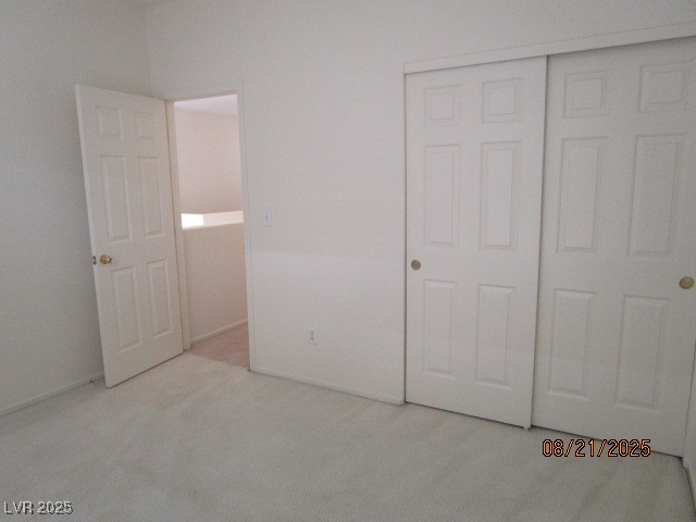 667 Solitude Point Avenue Henderson, NV 89012 - Photo 17 of 22 Unfurnished bedroom with light carpet and a closet