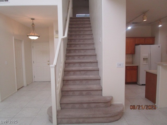 667 Solitude Point Avenue Henderson, NV 89012 - Photo 9 of 22 Stairway with tile patterned flooring