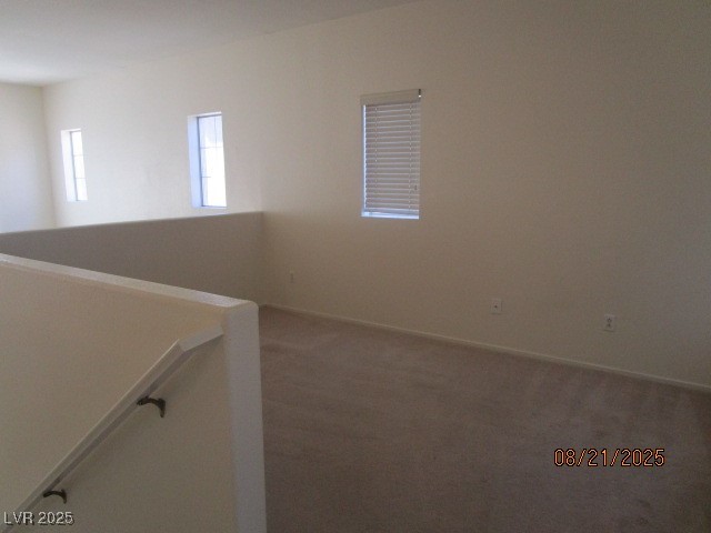 667 Solitude Point Avenue Henderson, NV 89012 - Photo 10 of 22 Carpeted empty room featuring baseboards