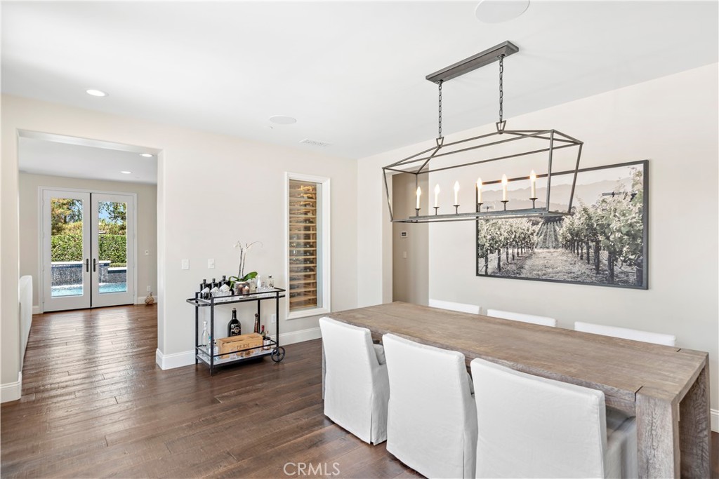 5 Connor Court Ladera Ranch, CA 92694 - Photo 14 of 63 a living room with hard wood floors and a table