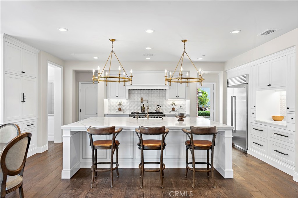 5 Connor Court Ladera Ranch, CA 92694 - Photo 19 of 63 a dining room with furniture window and wooden floor