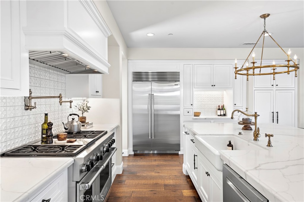 5 Connor Court Ladera Ranch, CA 92694 - Photo 21 of 63 a kitchen with stainless steel appliances a sink stove and cabinets
