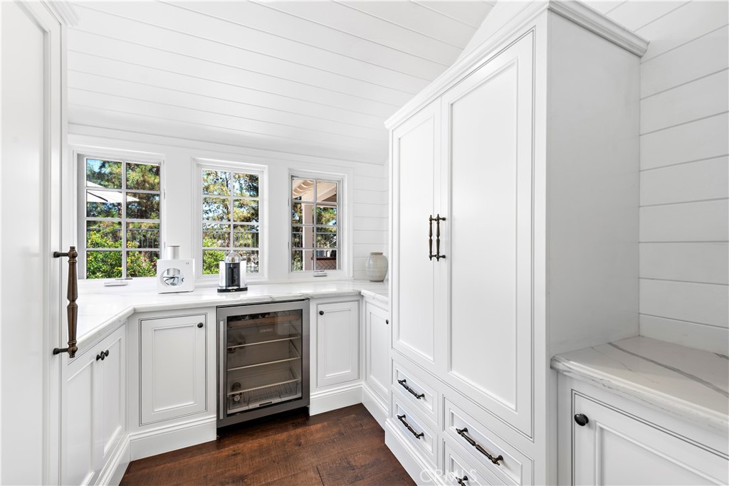 5 Connor Court Ladera Ranch, CA 92694 - Photo 24 of 63 a kitchen with white cabinets and sink