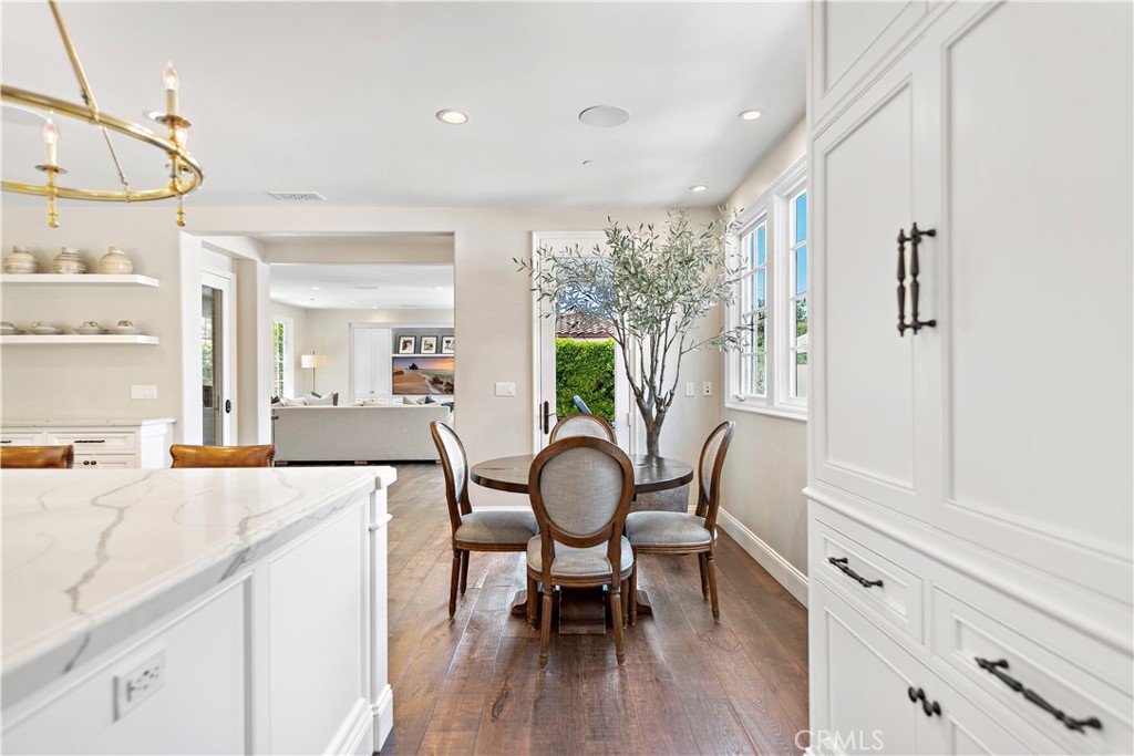 5 Connor Court Ladera Ranch, CA 92694 - Photo 25 of 63 a view of a dining room with furniture window and wooden floor