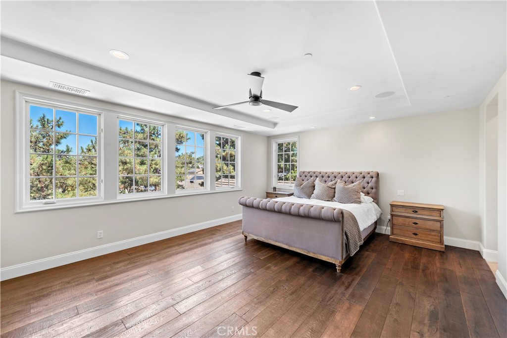 5 Connor Court Ladera Ranch, CA 92694 - Photo 27 of 63 a spacious bedroom with a bed and a large window