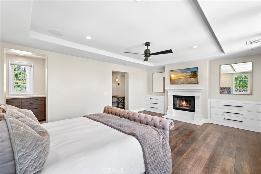 5 Connor Court Ladera Ranch, CA 92694 - Photo 28 of 63 a bedroom with a bed and a fireplace