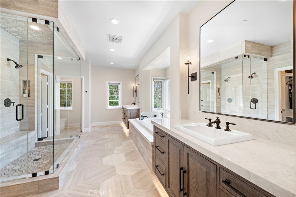 5 Connor Court Ladera Ranch, CA 92694 - Photo 29 of 63 a spacious bathroom with a double vanity sink shower and a mirror