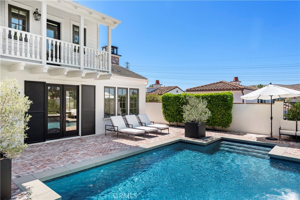 5 Connor Court Ladera Ranch, CA 92694 - Photo 40 of 63 a view of a house with backyard porch and sitting area
