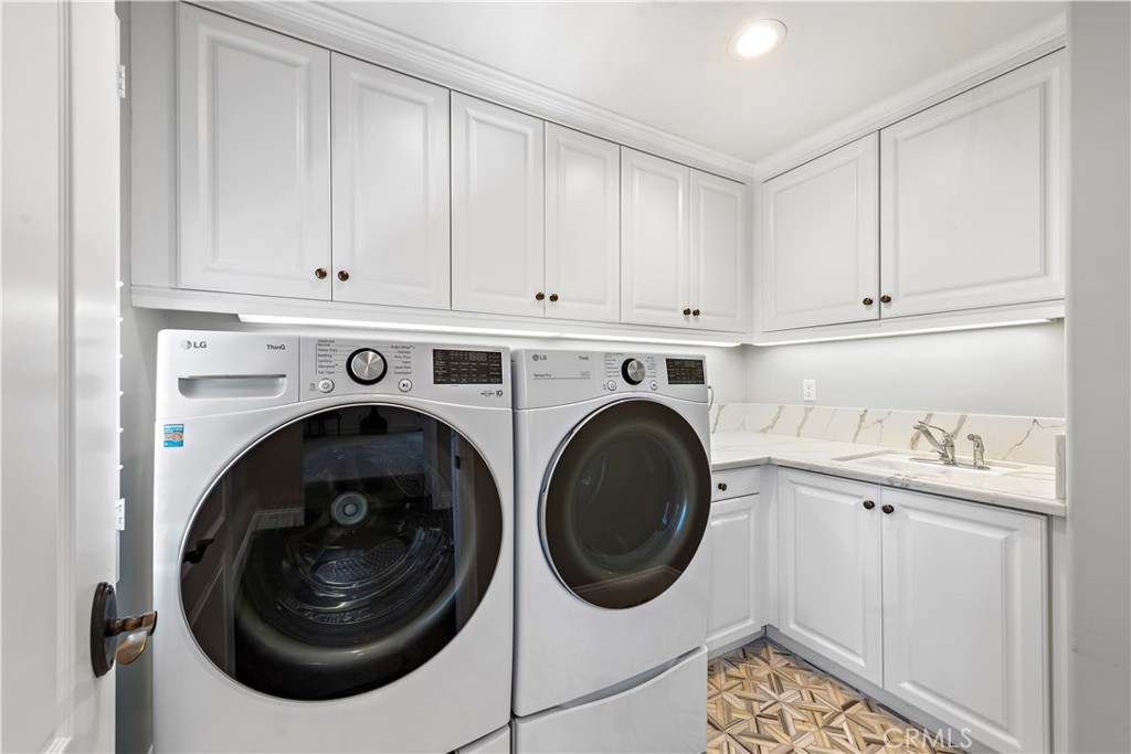 5 Connor Court Ladera Ranch, CA 92694 - Photo 46 of 63 a utility room with sink dryer and washer