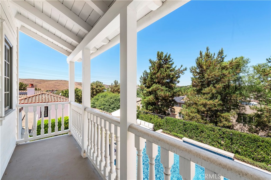 5 Connor Court Ladera Ranch, CA 92694 - Photo 47 of 63 a view of a porch with a floor to ceiling window and wooden fence