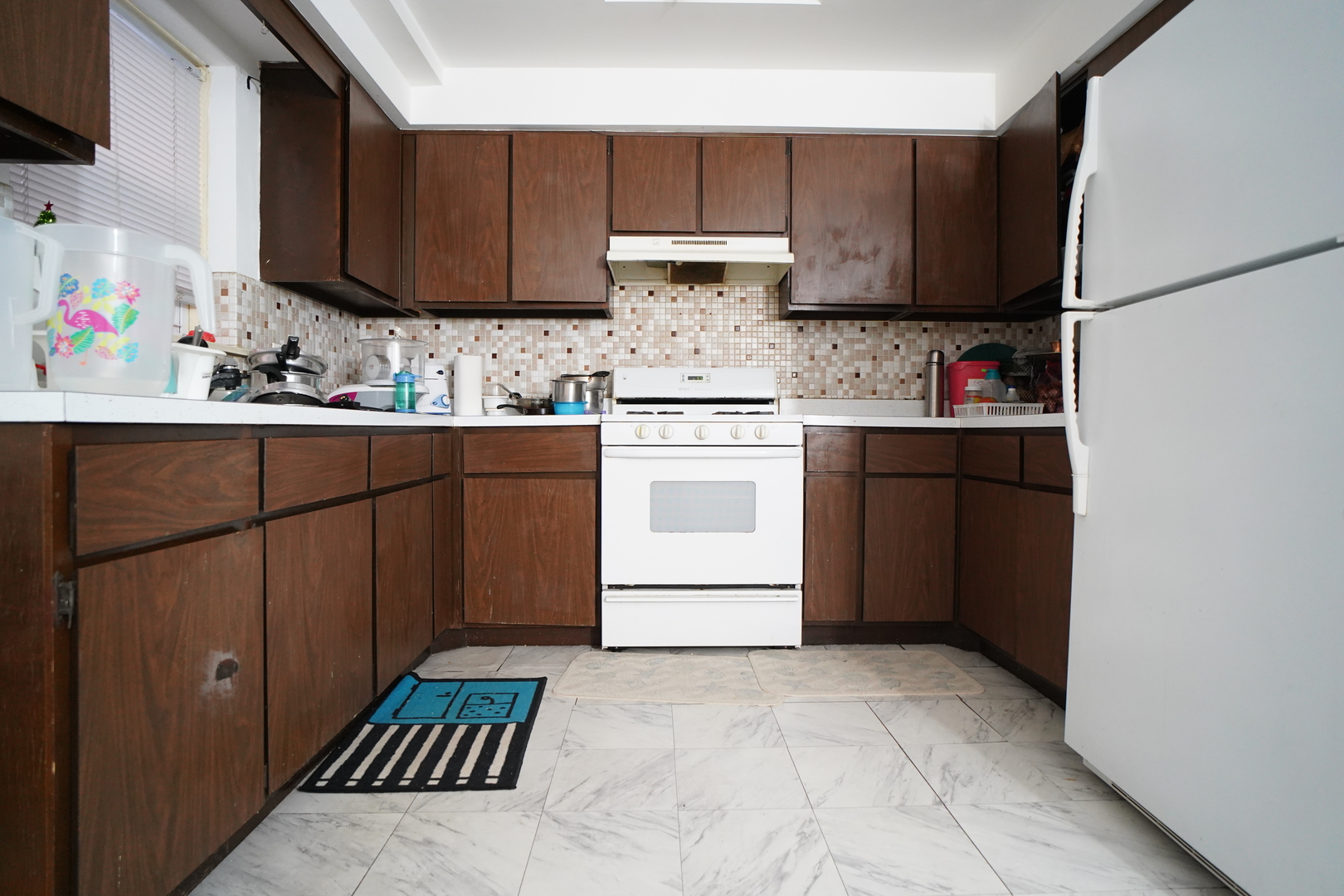 8518 West Rascher Avenue, Unit 2 Chicago, IL 60656 - Photo 6 of 8 a kitchen with stainless steel appliances granite countertop a refrigerator sink and cabinets