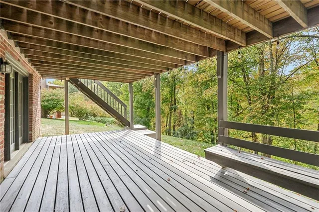 a view of a porch with wooden floor