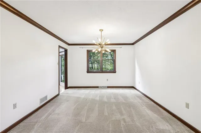 a view of an empty room and window