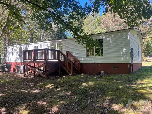 a large tree in front of a house