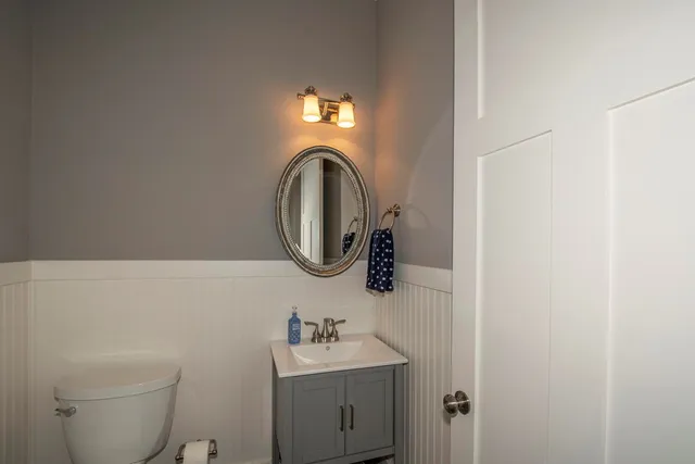 a view of a hallway with wooden floor and entryway