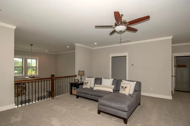 a view of entryway with furniture and wooden floor