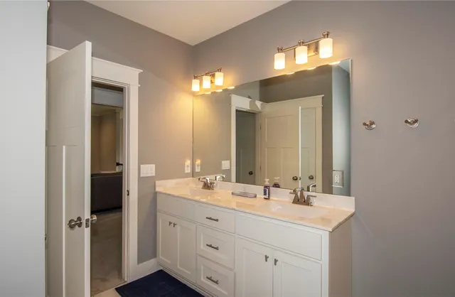 a bedroom with bed and a window