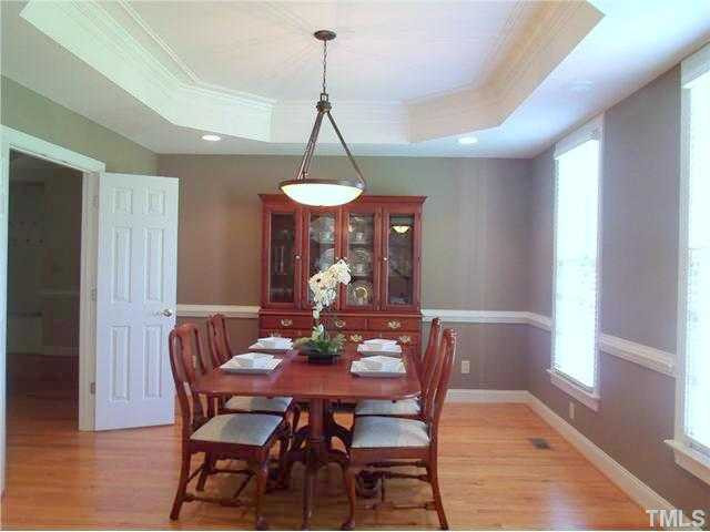 604 Mason Road Durham, NC 27712 - Photo 3 of 25 Dramatic formal dining room with gorgoeus trey ceiling with detailed molding and hardwood floors. Dining Room